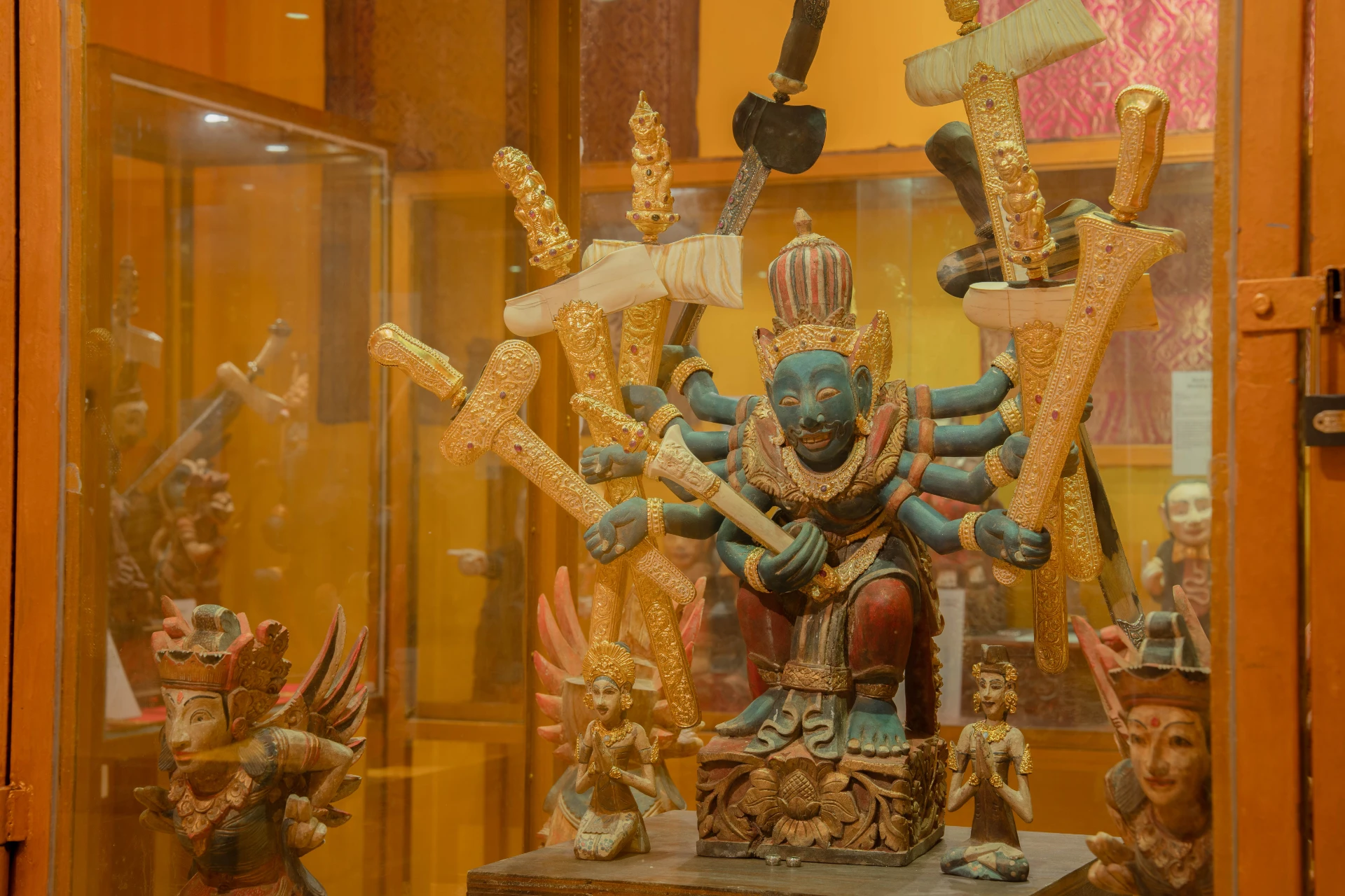 Illuminated glass display case featuring a large collection of ancient Indonesian gold jewelry, Gold Room, Museum Peter Bloch Collection.