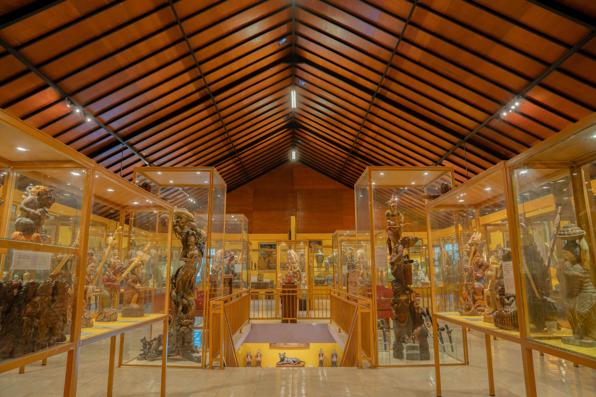 Interior of the Fidel Castro Room at Museum Peter Bloch Collection, featuring vibrant red walls and a gallery of historical photographs.