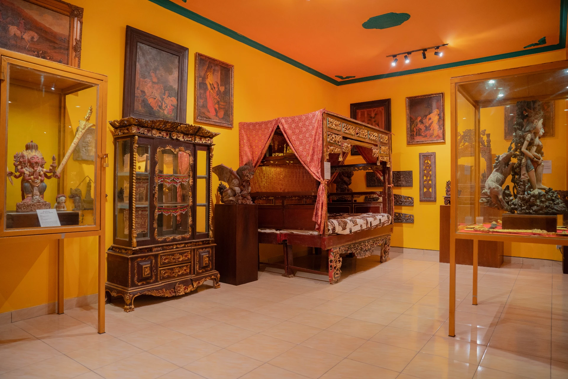 Perspective view of a grand 19th-century four-poster bed with white linens in the Mads Lange Bedroom, Museum Peter Bloch Collection.