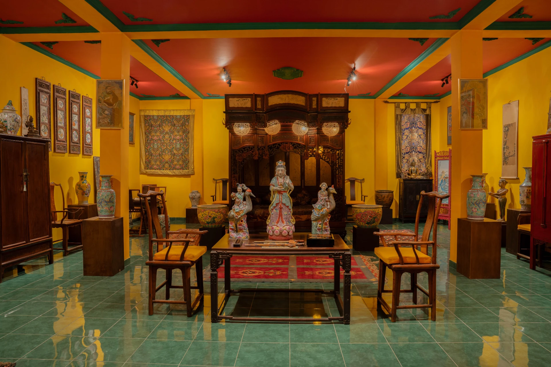 Statues of Guanyin and the Laughing Buddha (Budai) representing compassion and joy, Chinese Room, Museum Peter Bloch Collection.