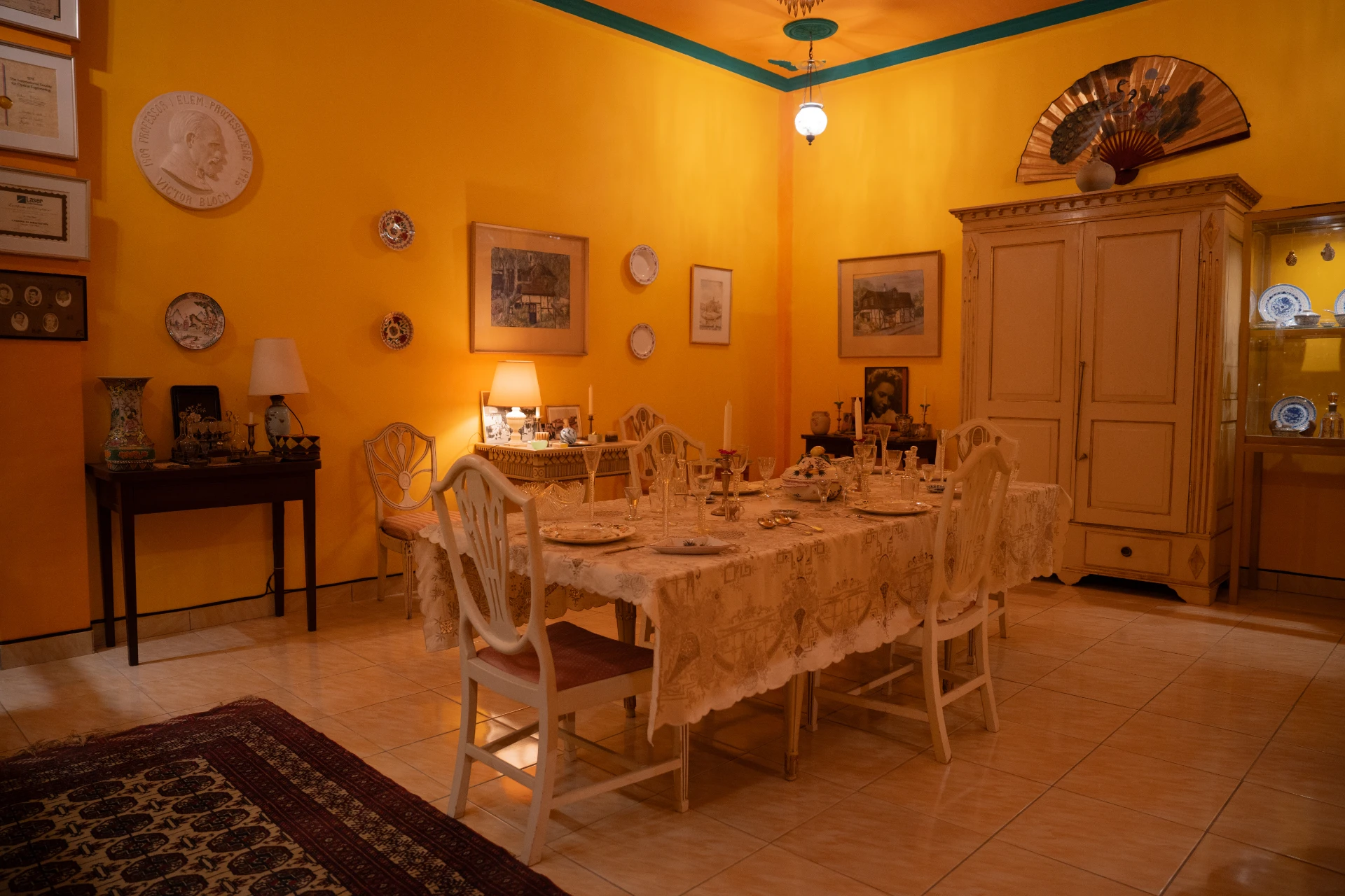 Interior of the VOC Room at Museum Peter Bloch Collection featuring Dutch colonial furniture and red walls.